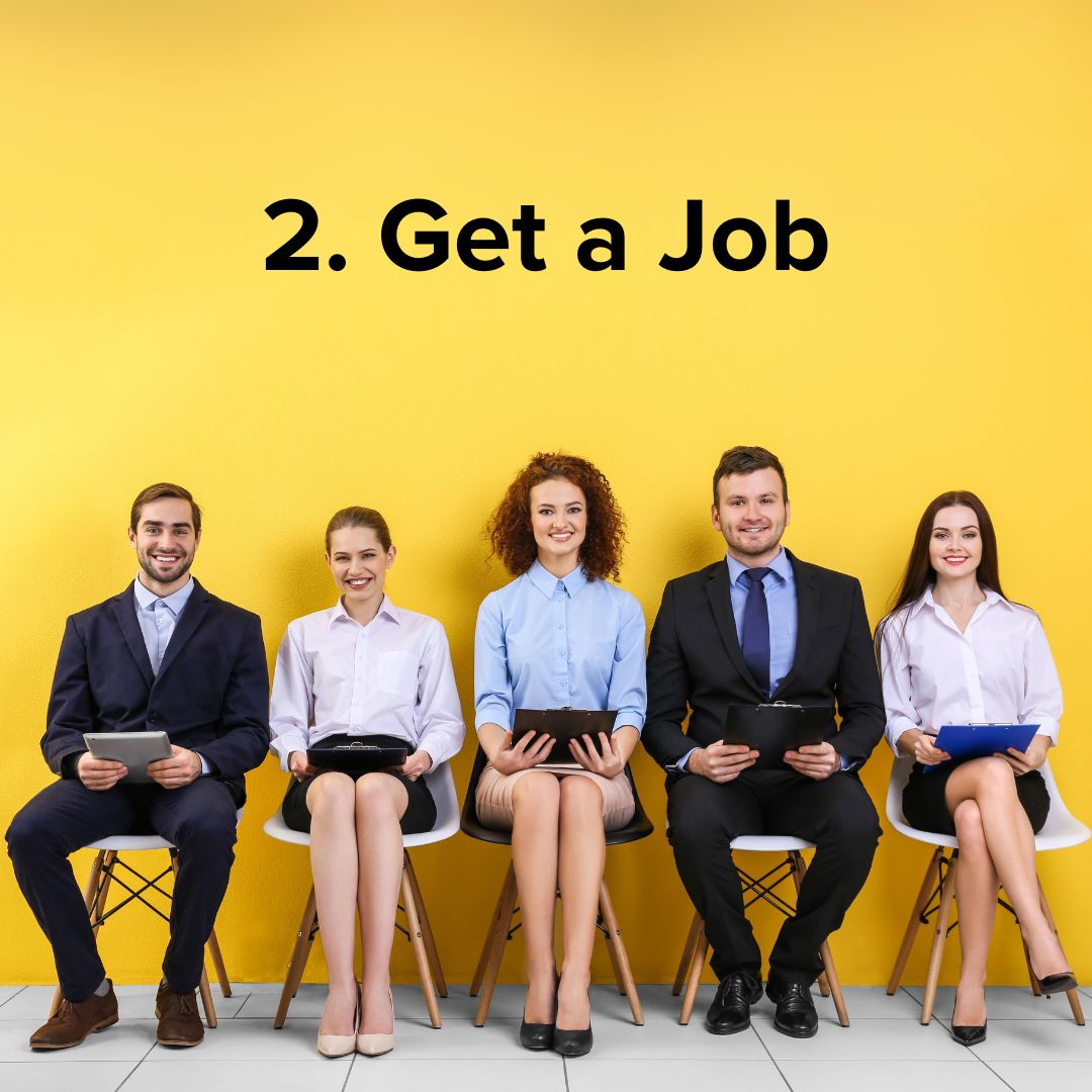 Yellow background wall and white tile flooring. Five job candidates dressed in business clothes sit on wooden chairs. They all appear to have a portfolio with a copy of their resume. The title in black is: '2. Get a Job'