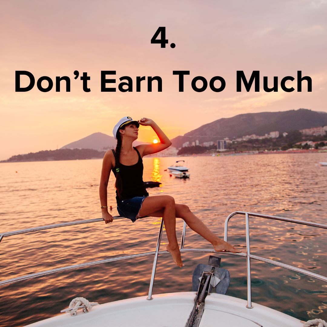 Woman sitting on the front of a large boat wearing a captain's hat at sunset. The title at the top in black says: '4. Don't Earn Too Much'