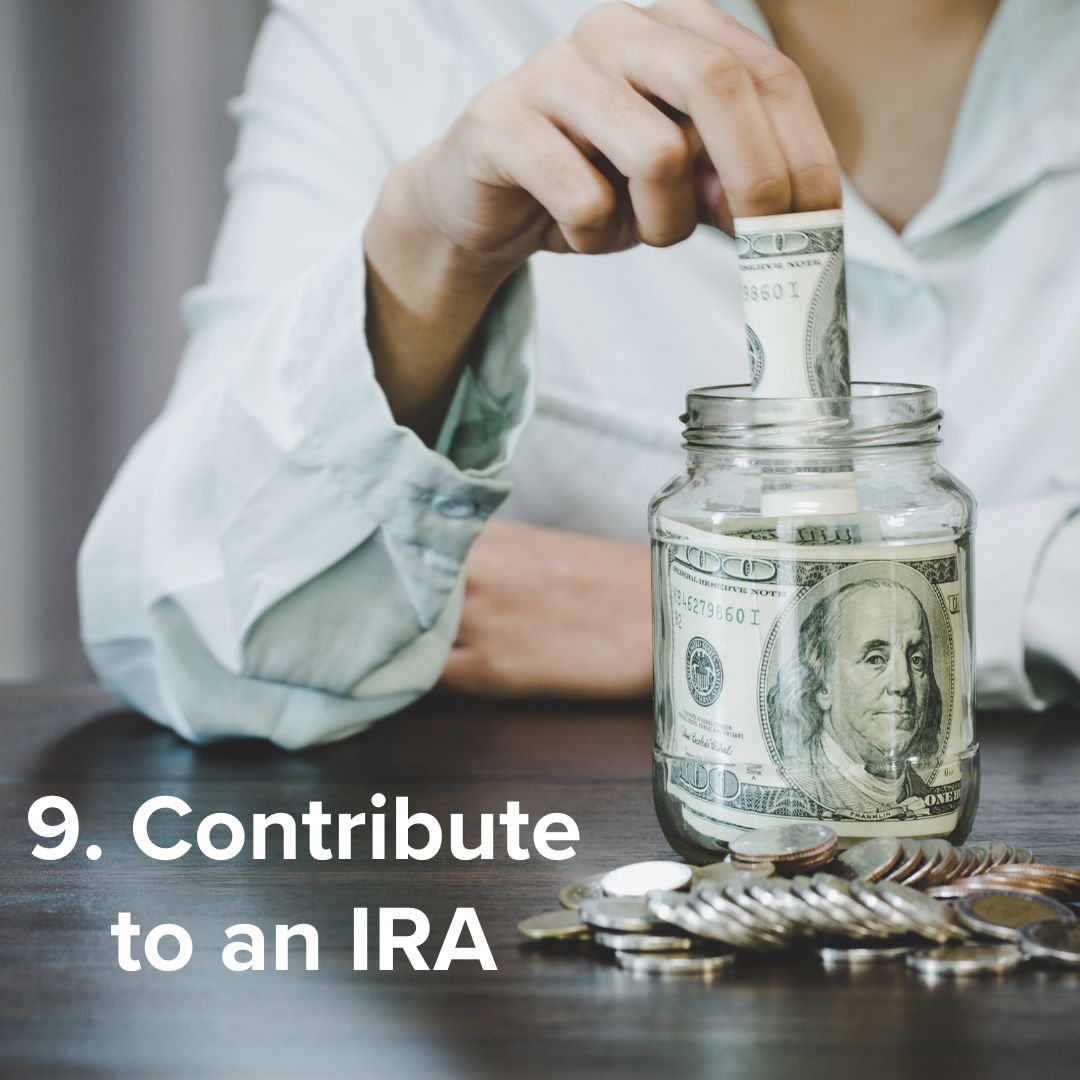 Title in white on the bottom: '9. Contribute to an IRA.' Image of someone putting a bill into a glass jar with a $100 bill already in it. Some coins sit on a table in front of the jar.