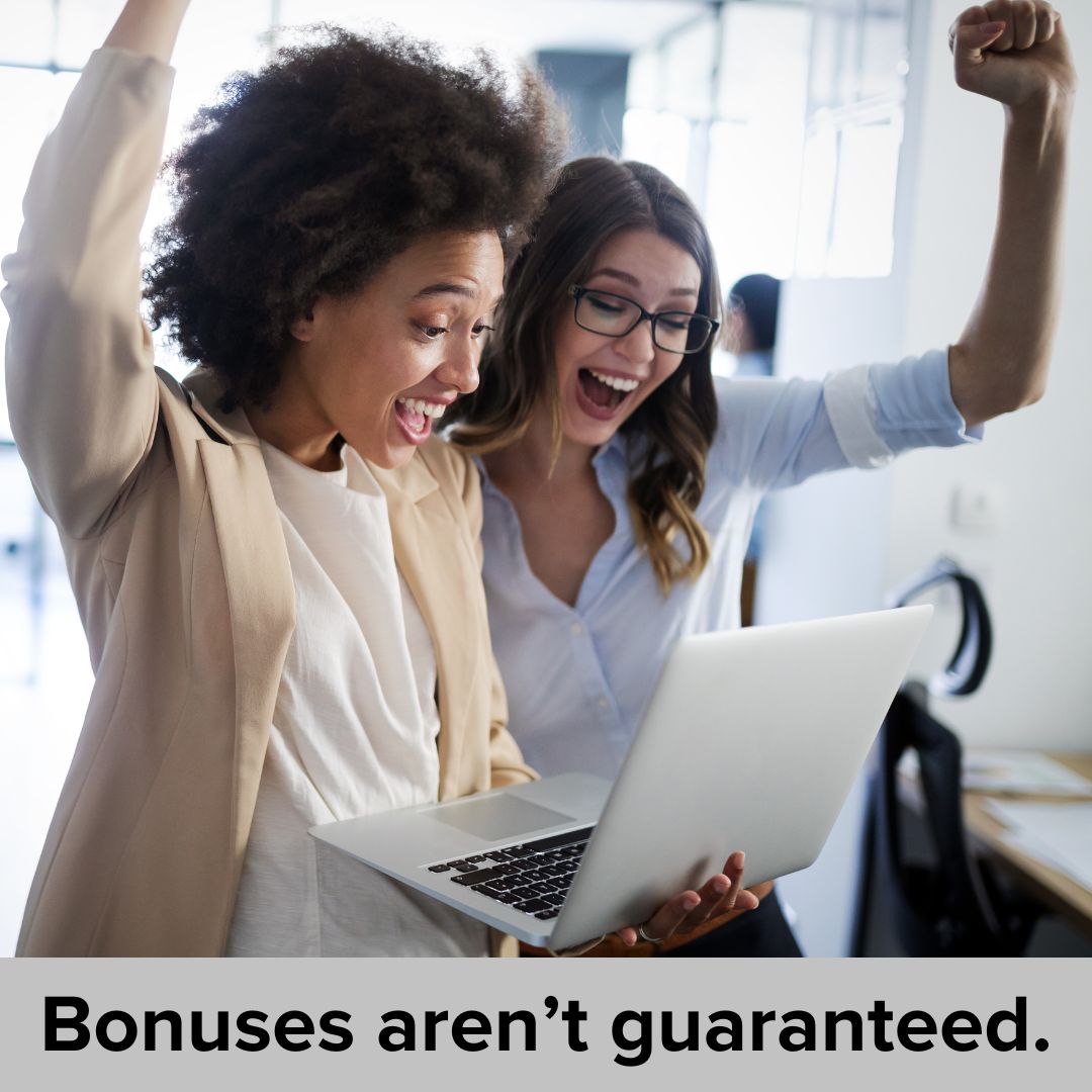 Two women in a workplace setting looking at a laptop together and cheering. The title at the bottom in black font says: Bonuses aren't guaranteed.
