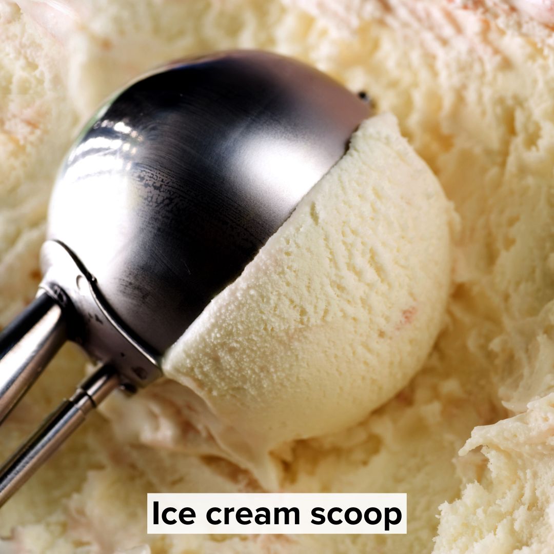 Title 'Ice cream scoop' in black on a white background toward the bottom. The image is of an ice cream scoop in ice cream.