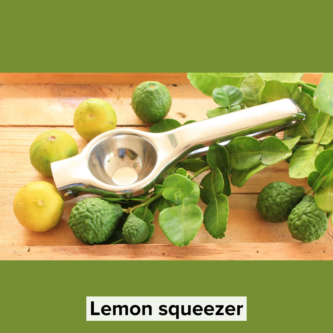 Title 'Lemon squeezer' in black surrounded by a light border on bottom. The image is of a lemon squeezer nestled within a few ripe lemons and a branch with lemons on a wooden table.